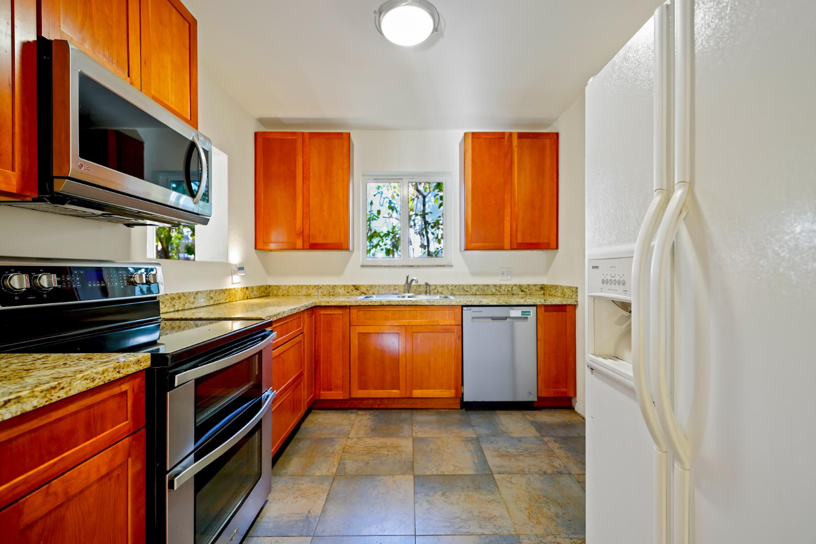 Kitchen detail showing cabinetry, counters, and appliance layout